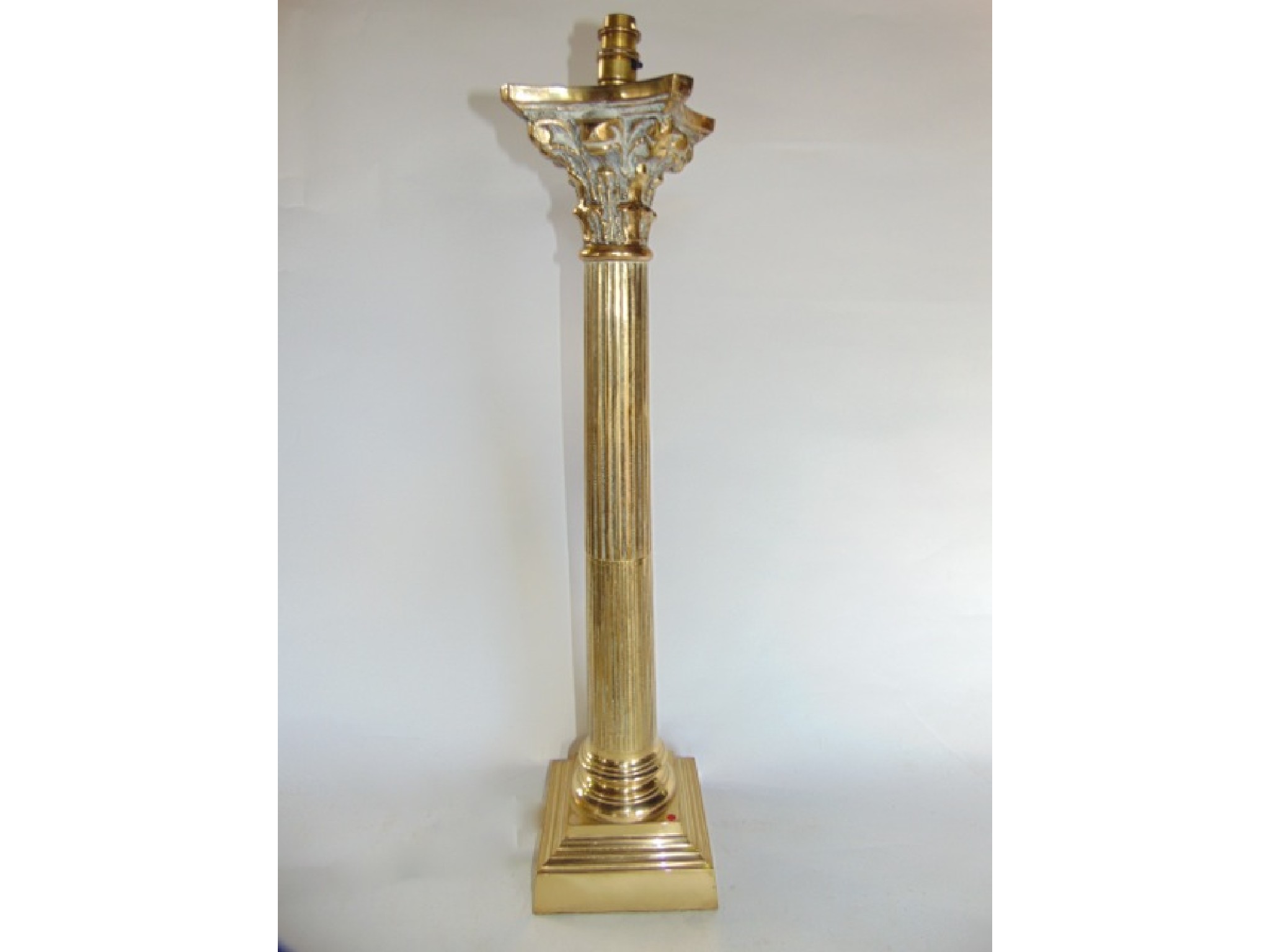 Appraisal: A substantial brass desk lamp in the form of a