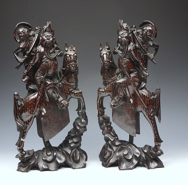 Appraisal: A PAIR OF ORIENTAL CARVED WOOD AND SILVER WIRE INLAID