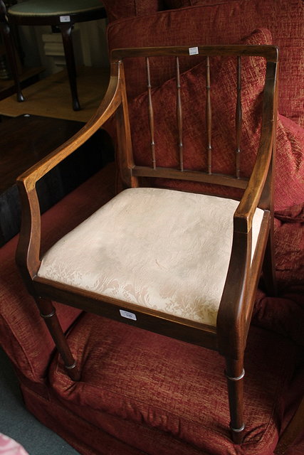 Appraisal: A MAHOGANY ELBOW CHAIR with upholstered drop in seat