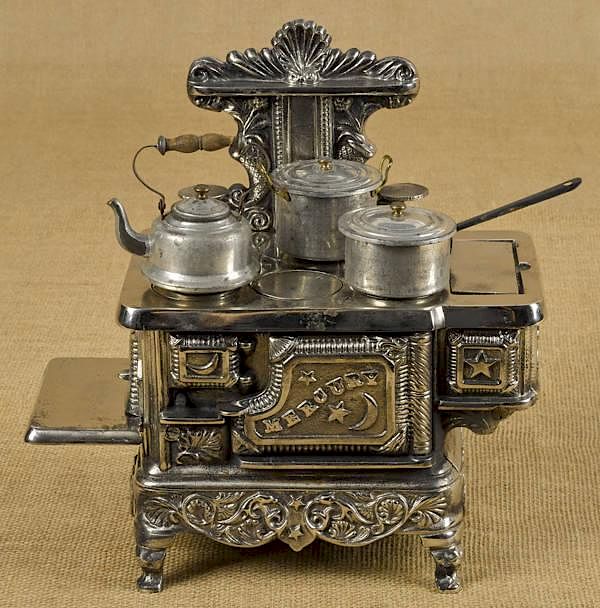 Appraisal: Cast iron and nickel Mercury toy stove with tin Cast