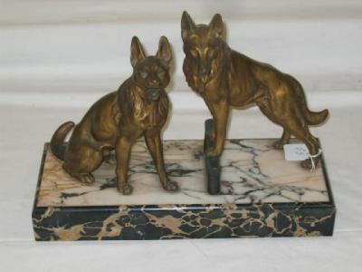 Appraisal: AN ART DECO SPELTER GROUP of two German shepherd dogs