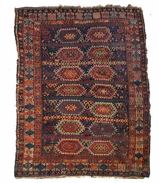 Appraisal: A PERSIAN KURDISH BLUE GROUND RUG decorated two rows of