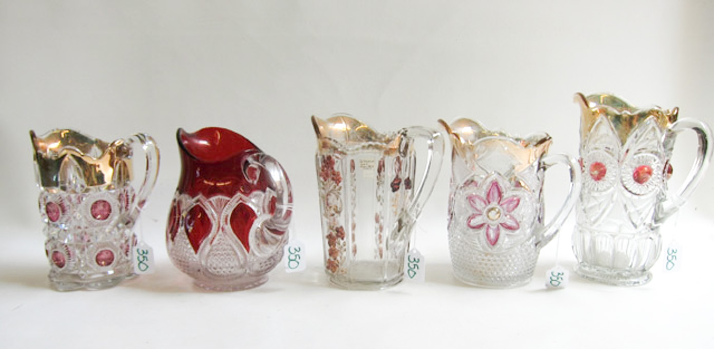 Appraisal: FIVE VICTORIAN GLASS PITCHERS in various patterns such as Bullseye