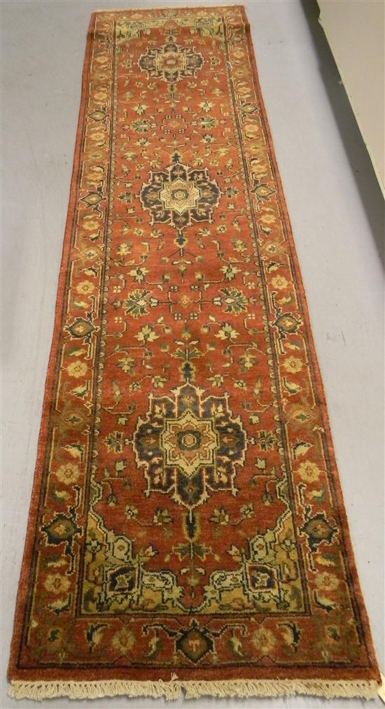 Appraisal: Agra Serapi Runner polychrome accents on terracotta field with navy