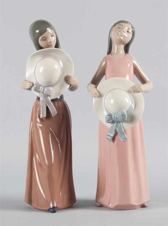 Appraisal: Two Lladro porcelain figures each of a young girl holding