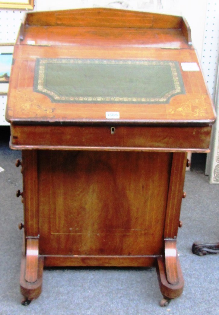 Appraisal: A Victorian marquetry inlaid walnut Davenport with ink drawer and