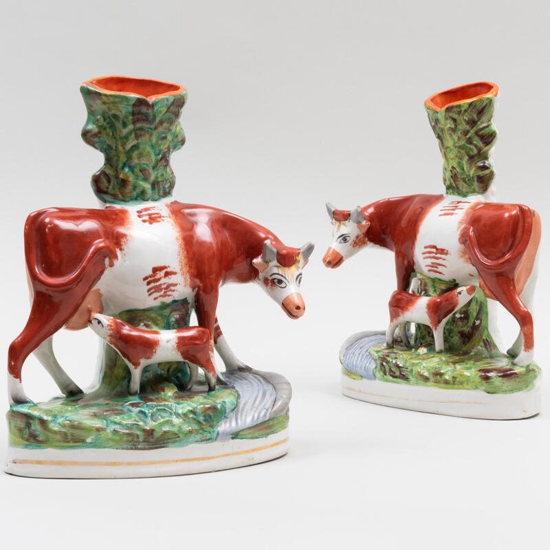 Appraisal: Pair of Staffordshire Cow Group Spill Vases Unmarked x x