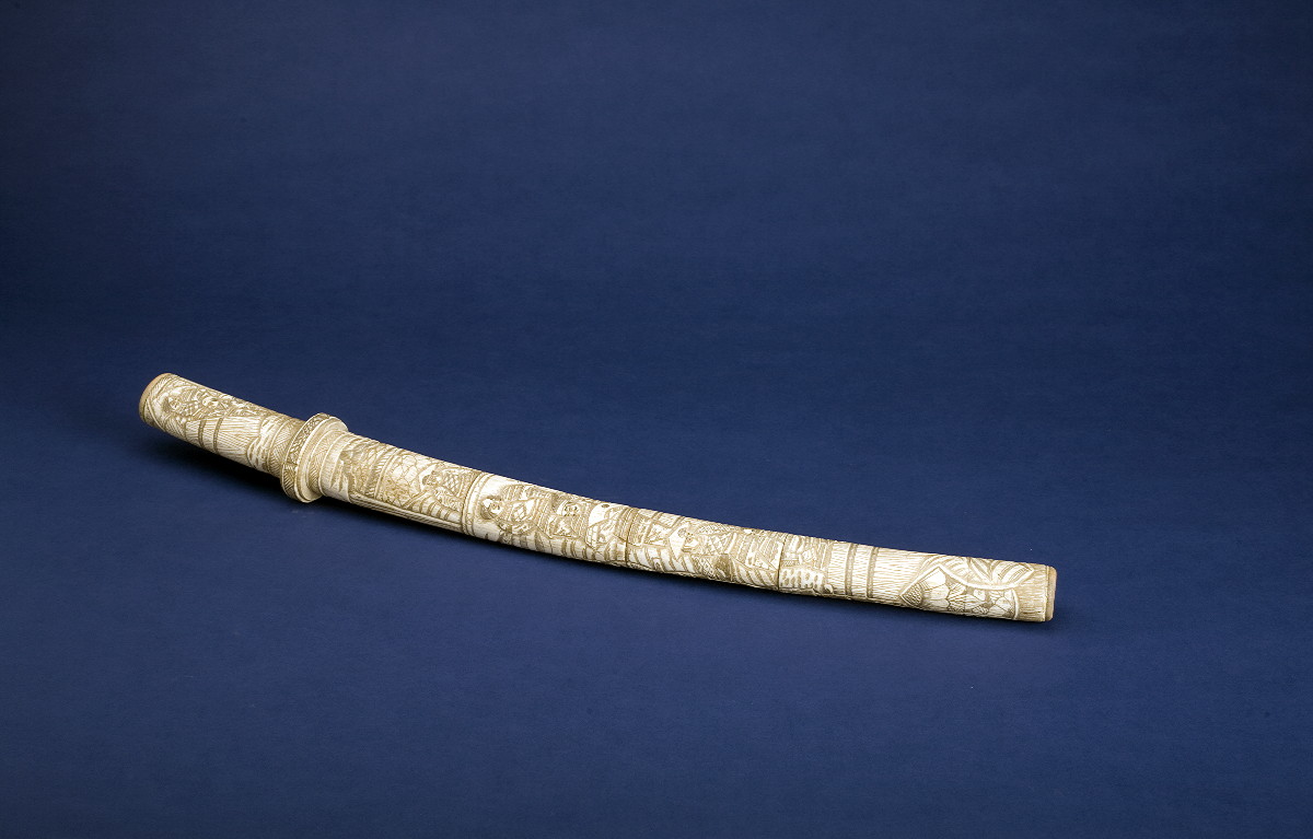 Appraisal: CARVED IVORY WAKIZASHI The sword with steel blade and ivory