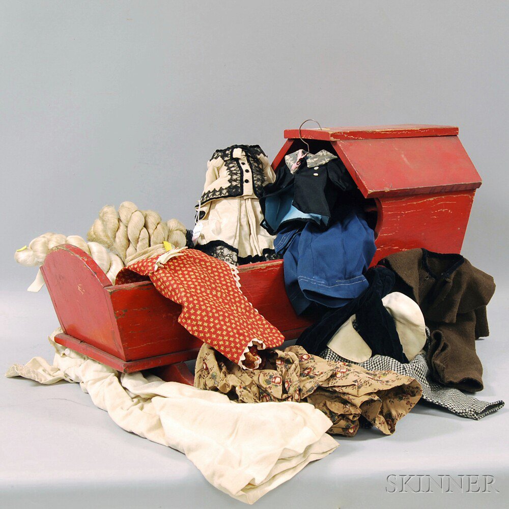 Appraisal: Red-painted Hooded Cradle with Doll Clothing including a cloth lady