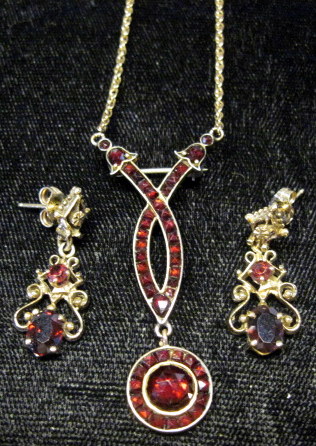 Appraisal: Yellow gold garnet earrings and pendant karat yellow gold drop