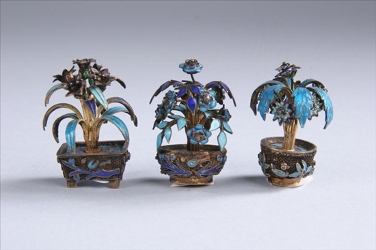 Appraisal: THREE CHINESE ENAMELLED FILIGREE SILVER MINIATURE FLOWER-FILLED VASES Early th