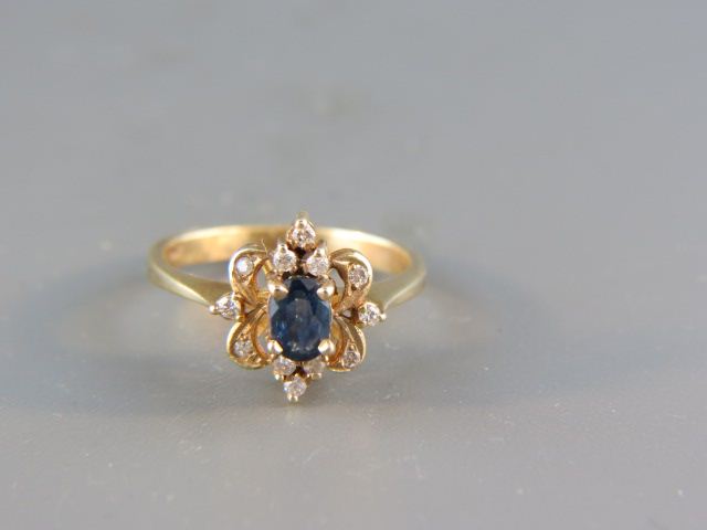 Appraisal: Sapphire Diamond Ring carat rich blue gem surrounded by round