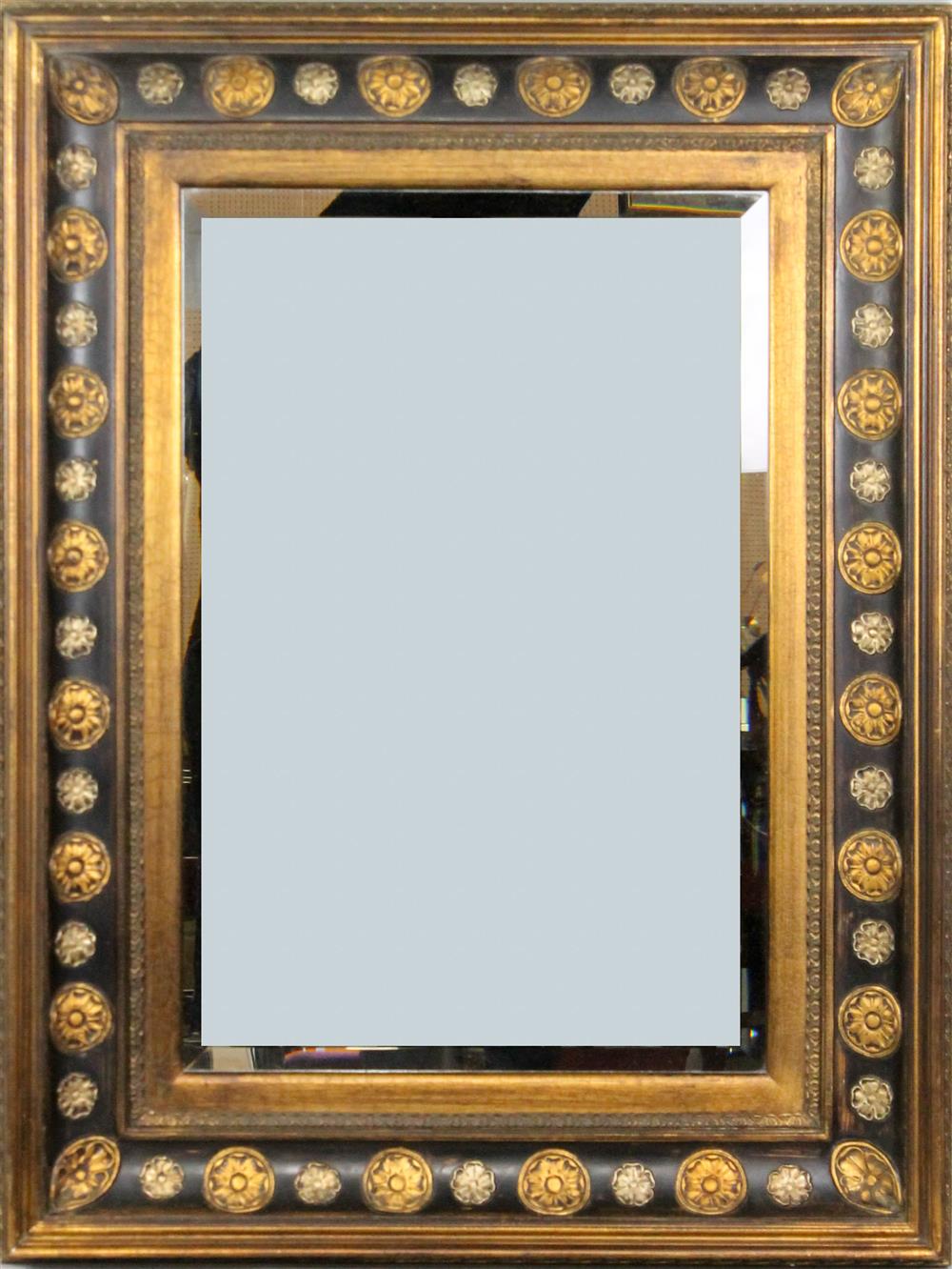 Appraisal: LARGE EBONIZED AND GILT FRAMED MIRROR BY BASSETT having a