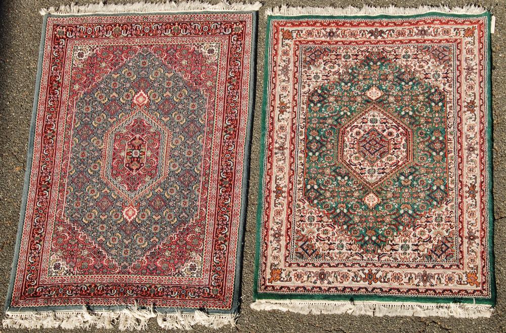 Appraisal: TWO COMPLIMENTARY KASHAN MEDALLION RUGS the first with octagonal medallion