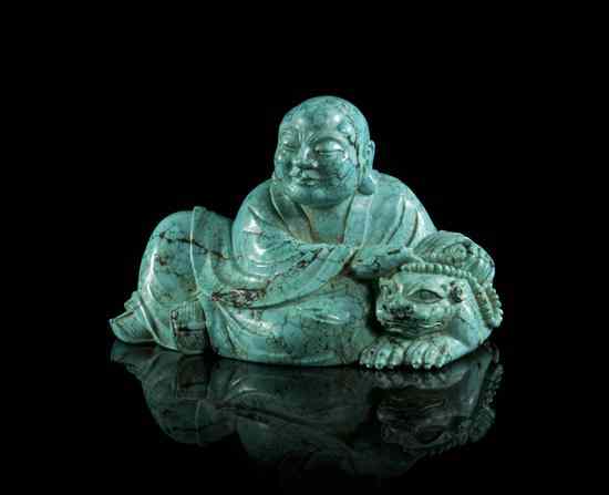 Appraisal: A Carved Turquoise Figure of Buddha depicted reclining in draped