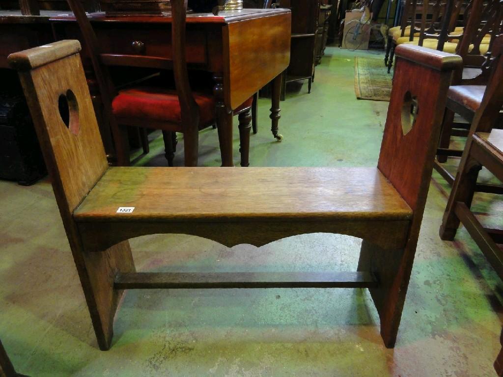 Appraisal: An Arts Crafts style oak hall bench with planked seat