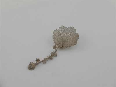 Appraisal: An early th century filigree caddy spoon the tendril stem