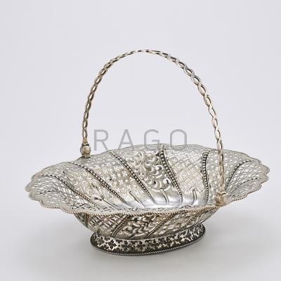 Appraisal: GEORGIAN RETICULATED STERLING CAKE BASKET Intricate pierced sections in six