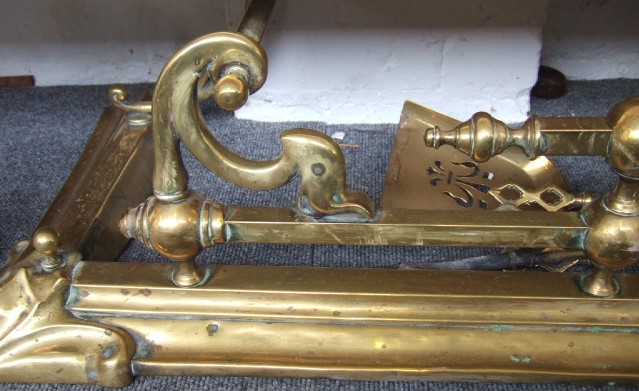 Appraisal: An Art Nouveau brass fender cm wide together with a