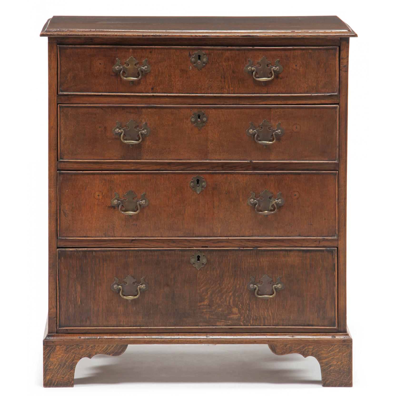 Appraisal: English Chippendale Style Bachelor's Chest circa oak veneer pine secondary