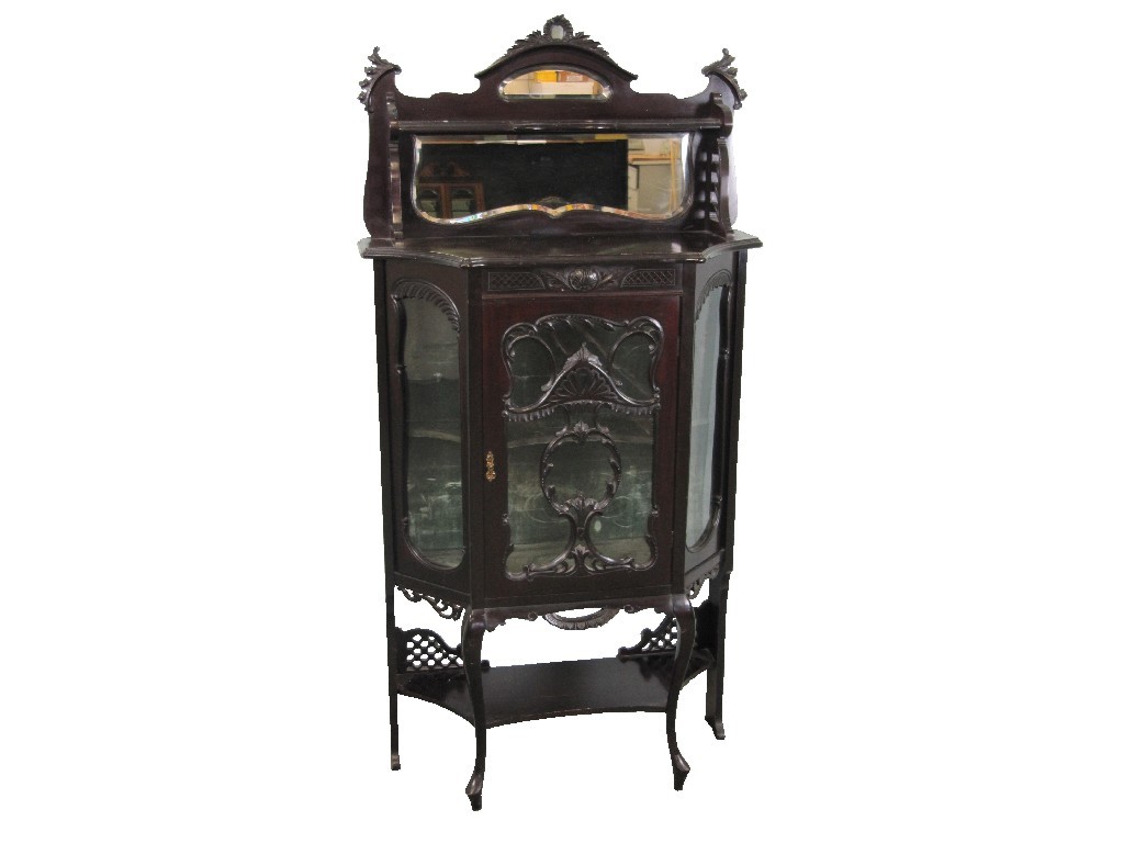 Appraisal: Edwardian display cabinet the mirrored top raised over a richly