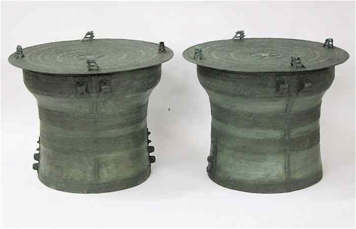 Appraisal: A PAIR OF PATINATED BRONZE RAIN DRUMS in the manner