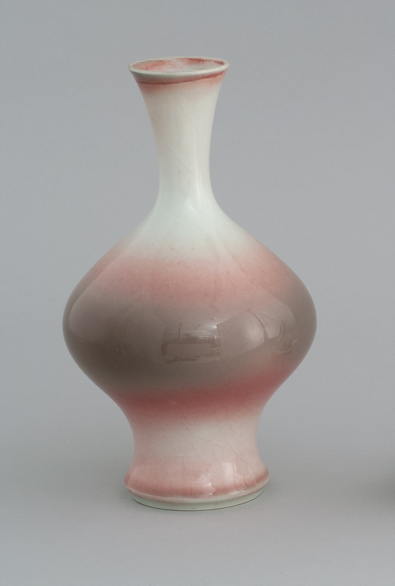 Appraisal: MAKAZU KOZAN STUDIO PORCELAIN VASE In baluster form with pink