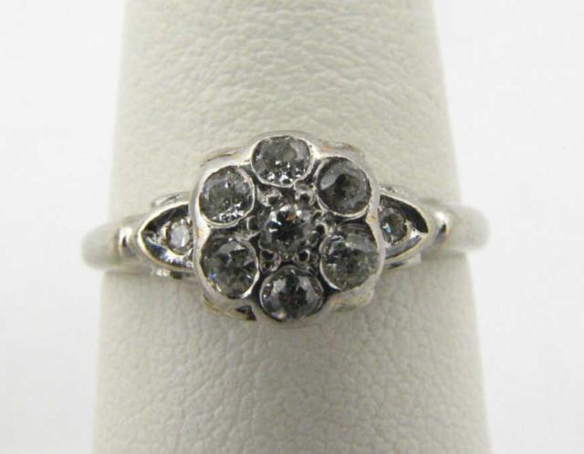 Appraisal: K white gold diamond cluster ring in flower design with