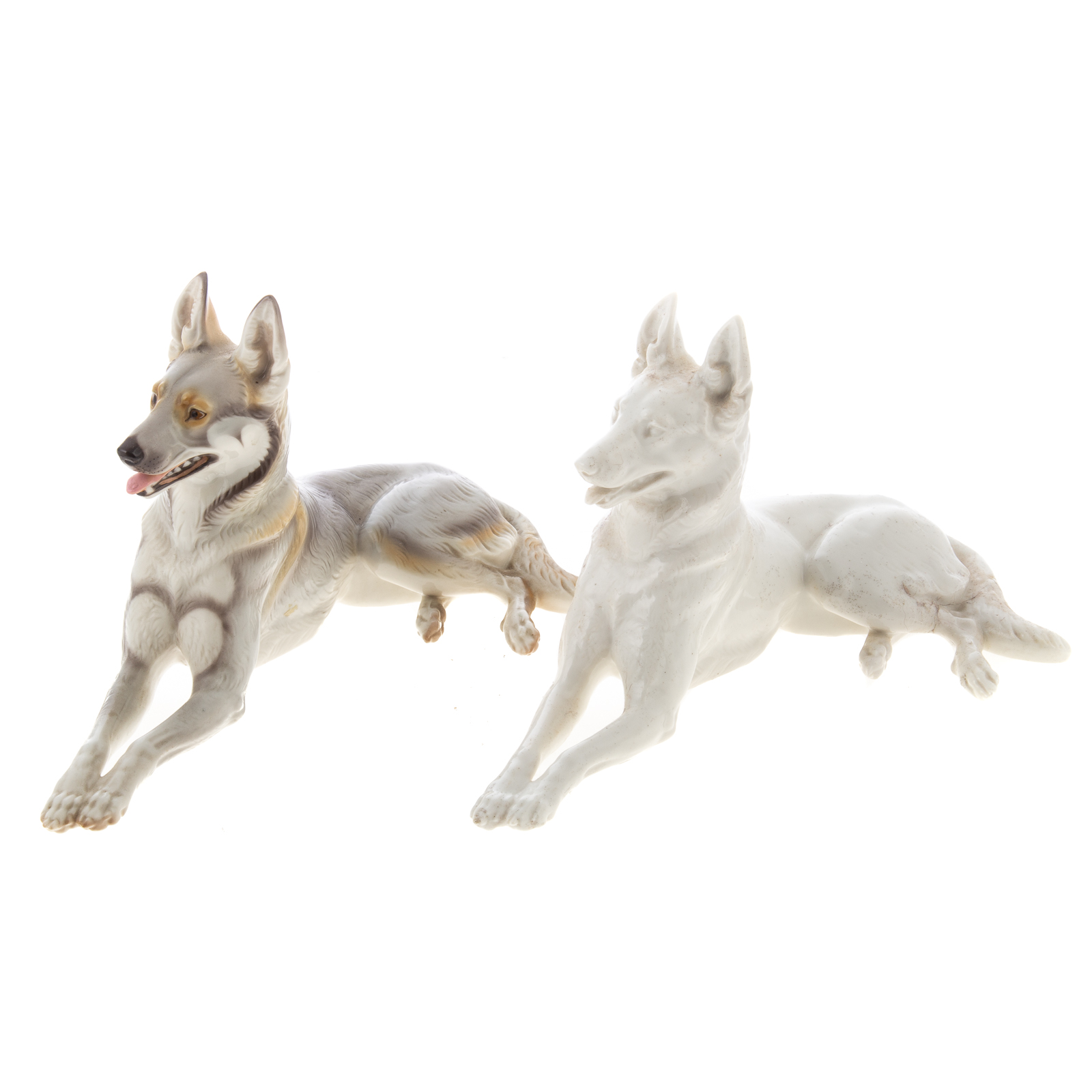 Appraisal: TWO NYMPHENBURG PORCELAIN GERMAN SHEPHERDS Circa s recumbent German Shepherd