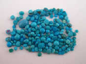 Appraisal: A quantity of loose polished turquoise approx carats VAT will