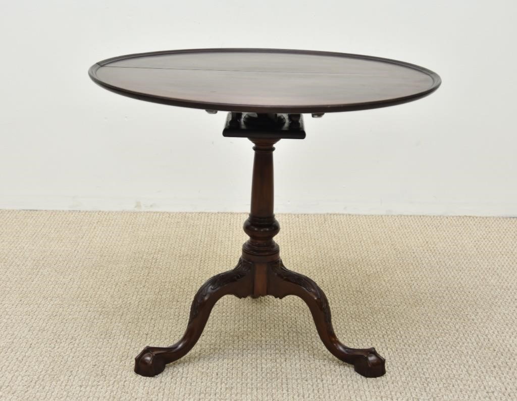 Appraisal: Chippendale mahogany tea table with dish top birdcage support ball