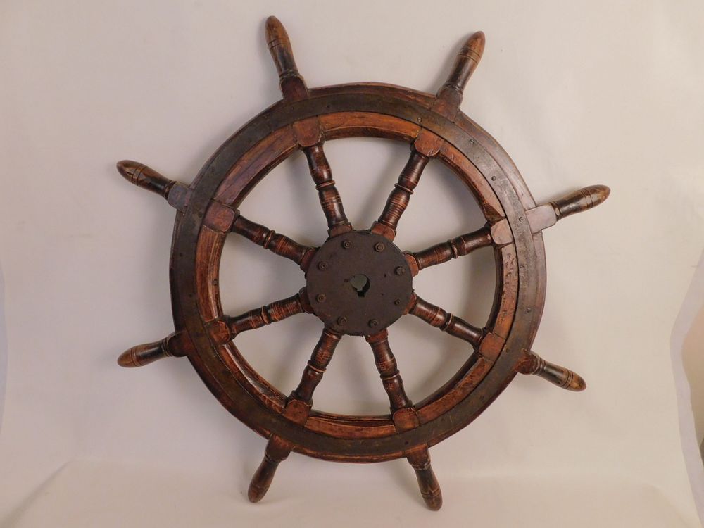 Appraisal: ANTIQUE WOOD IRON SHIPS WHEEL Antique wood and iron ships