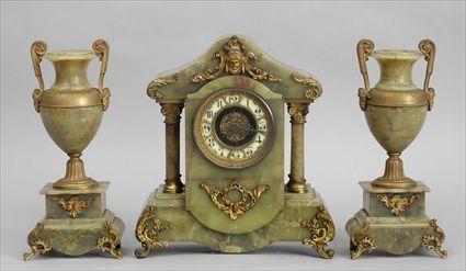 Appraisal: RENAISSANCE-STYLE ASSEMBLED THREE-PIECE GILT-METAL MOUNTED ONYX CLOCK GARNITURE The clock