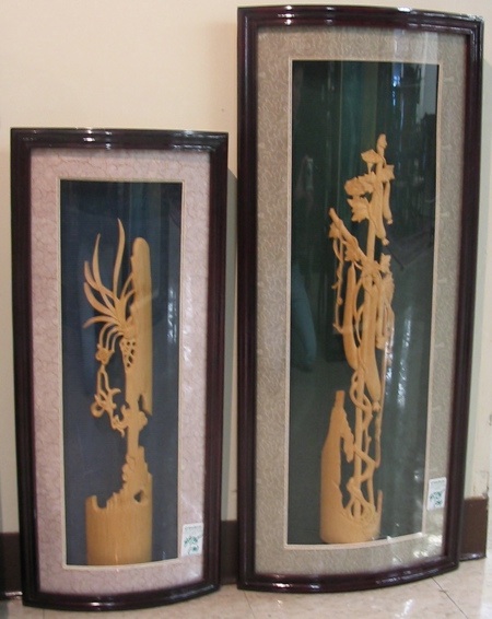 Appraisal: TWO CHINESE BAMBOO CARVINGS with stylized flora and or fruiting