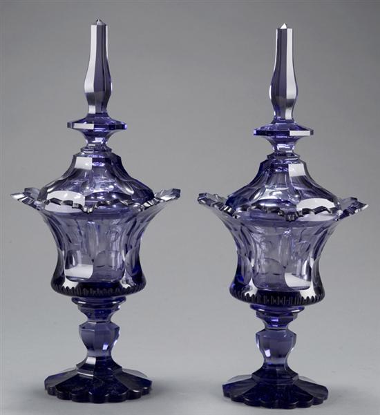 Appraisal: Pair of amethyst glass sweet meat dishes or covered urns