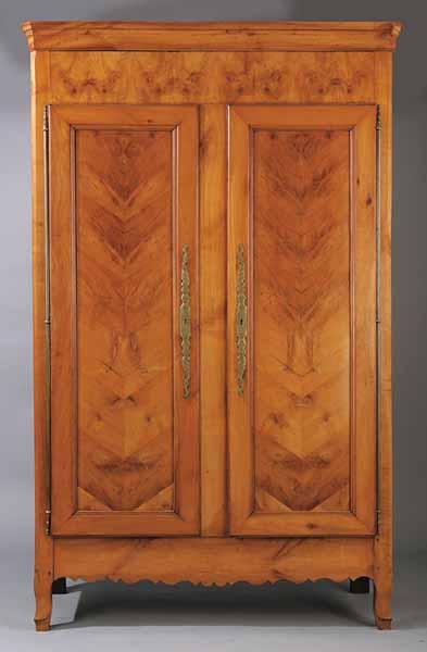 Appraisal: An Antique Continental Figured Birch Armoire th c the molded