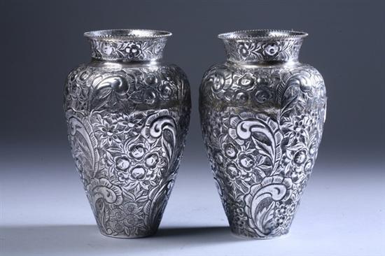 Appraisal: PAIR INDONESIAN REPOUSSE SILVER VASES Marked Floral and foliate decoration