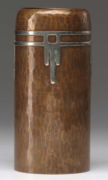 Appraisal: ROYCROFT Hammered copper cylindrical vase with silver overlay Orb Cross