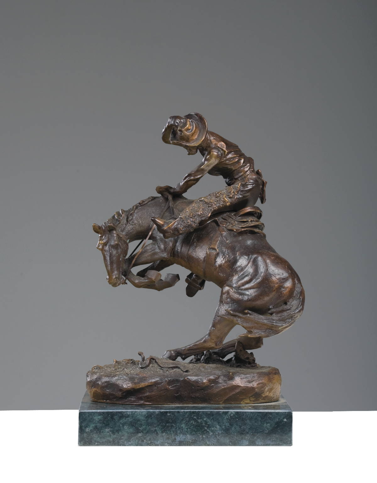 Appraisal: SMALL BRONZE OF quot THE RATTLESNAKE quot AFTER FREDERIC REMINGTON