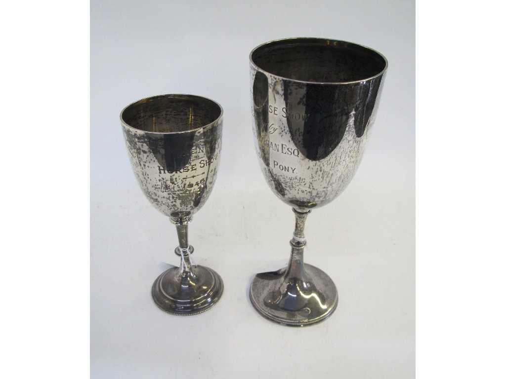 Appraisal: A lot comprising two silver horse riding trophies London and