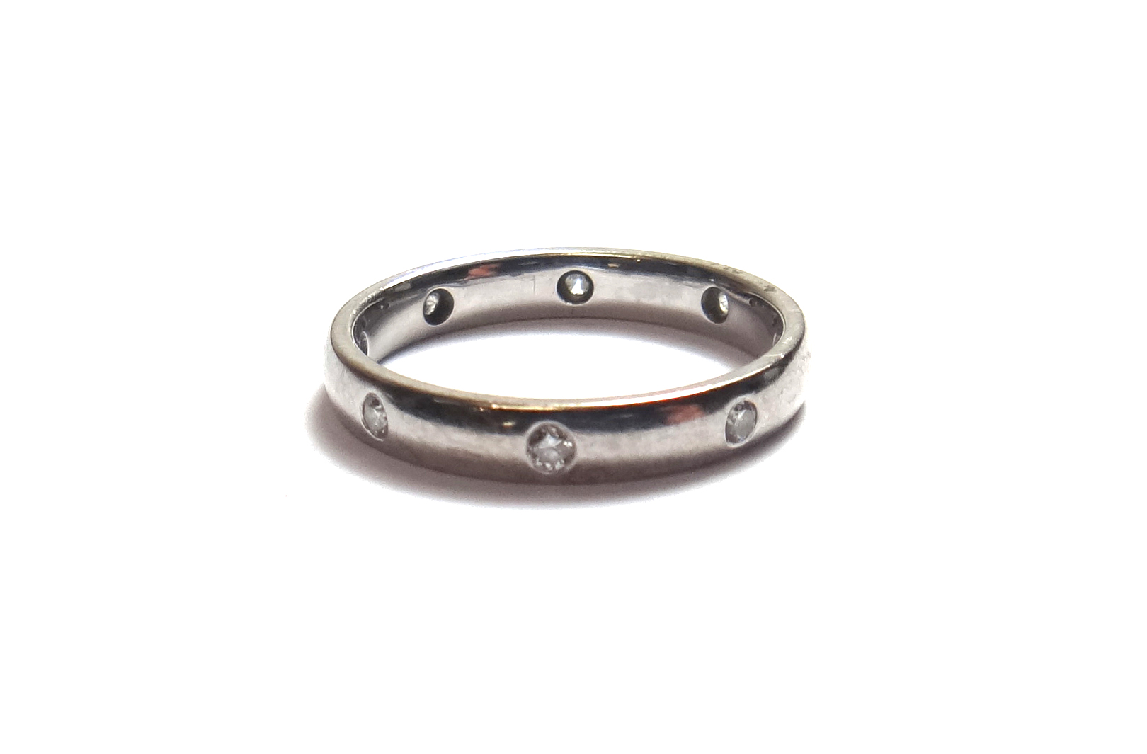 Appraisal: A white gold and diamond set eternity ring the plain