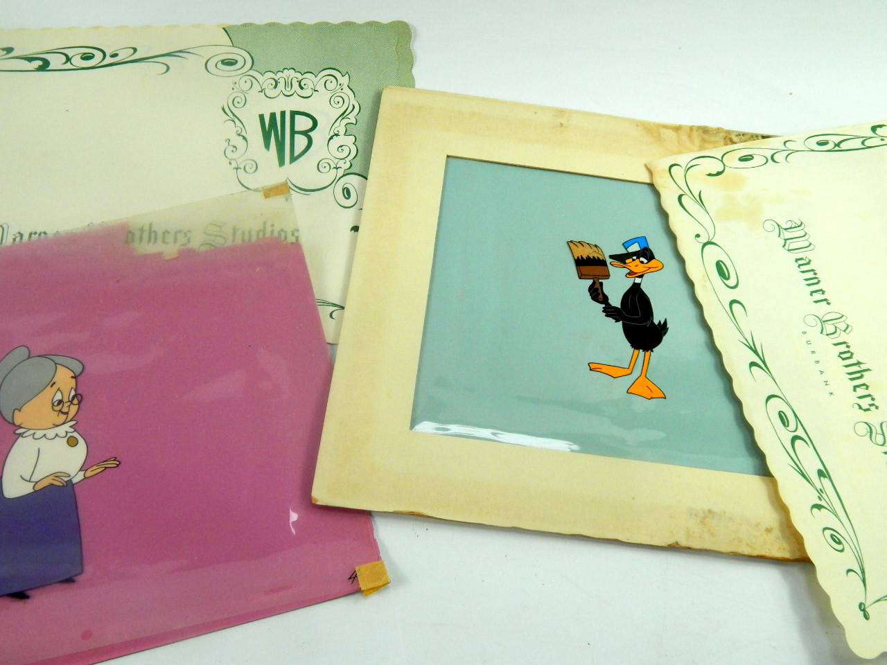 Appraisal: Three Warner Brothers Studio animation cells of Sylvester Daffy Duck