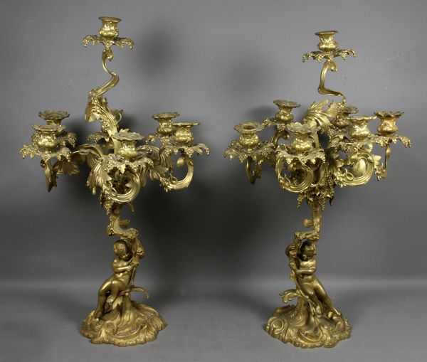 Appraisal: Pair of th Century gilt brass candelabra with cherub figures