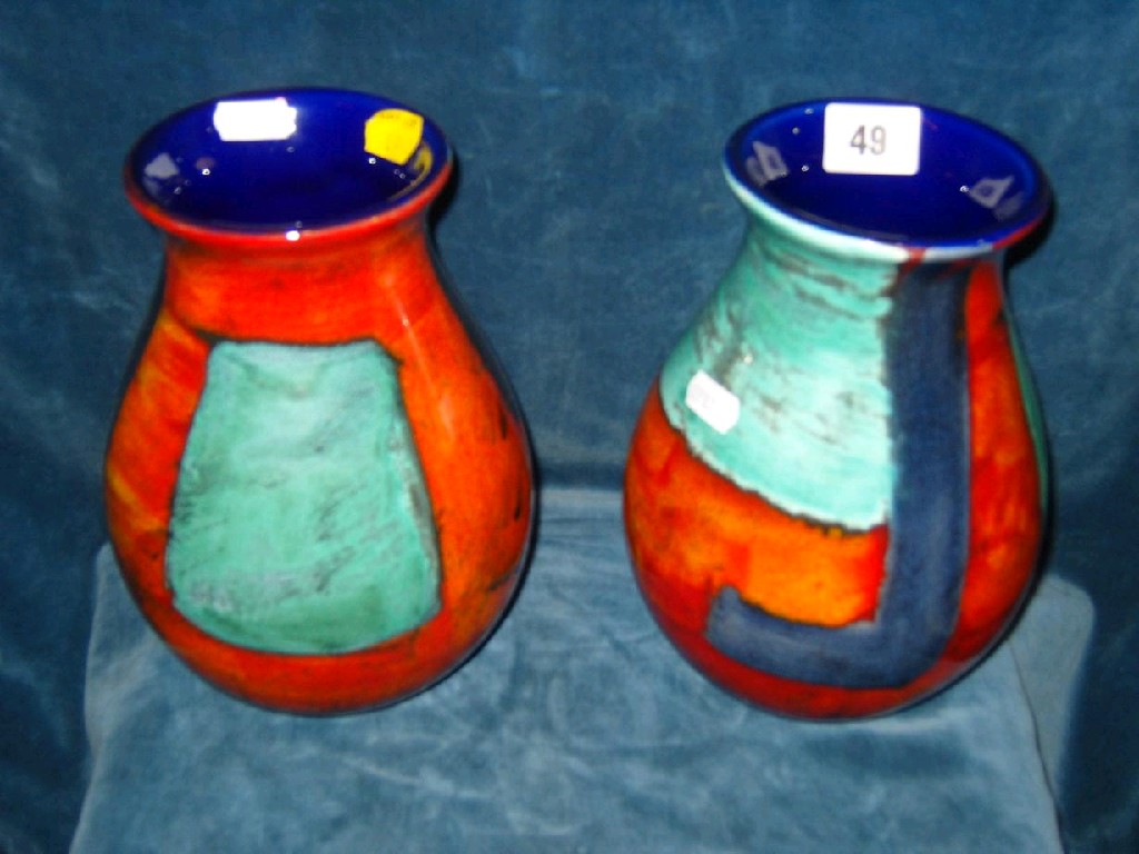 Appraisal: A pair of Poole Pottery vases with painted abstract decoration