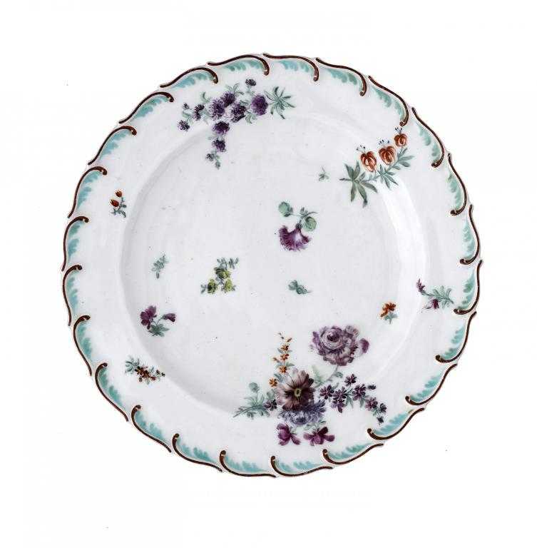 Appraisal: A CHELSEA PLATE enamelled with principally mauve sprays and scattered