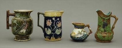 Appraisal: Four Majolica Pitchers Tallest pitcher in in diam