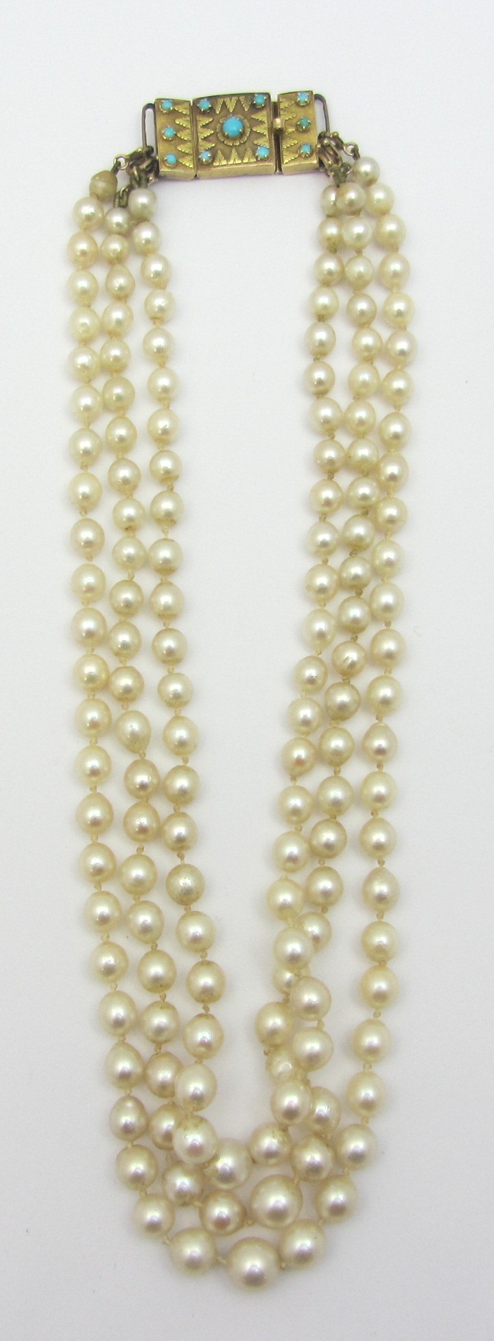 Appraisal: A three row necklace of graduated cultured pearls on a