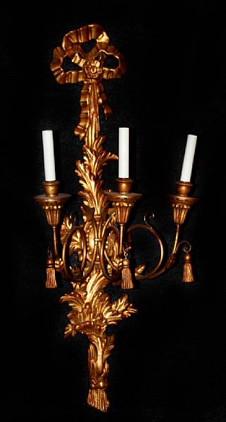 Appraisal: A pair of Rococo style gilt wood two light wall