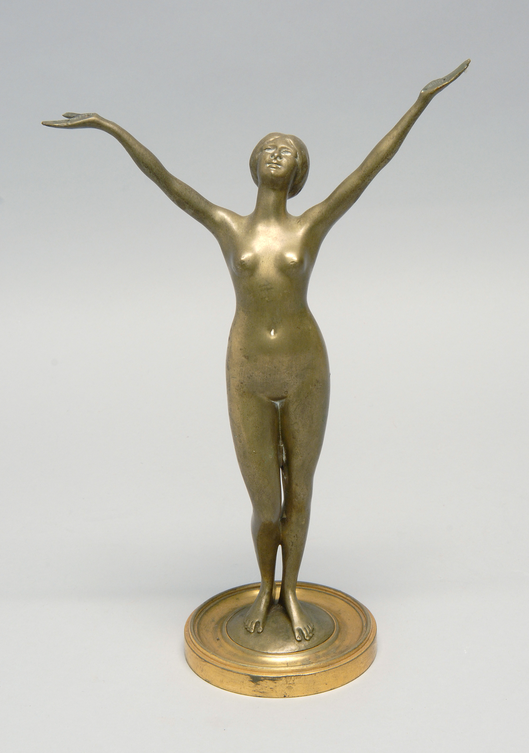 Appraisal: BRONZE FIGURE OF A FEMALE NUDE with outstretched arms Two