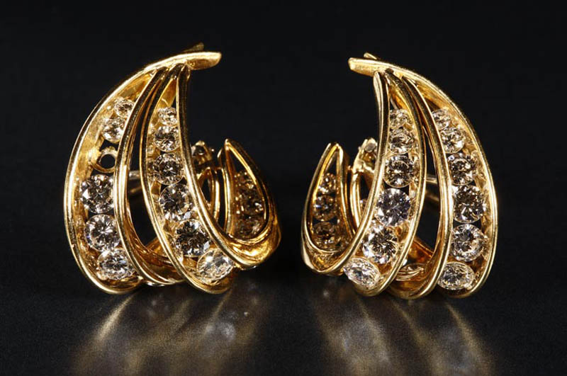 Appraisal: A pair of gold and diamond ear clips A pair